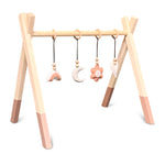 Wooden baby gym | Solid wooden play arch teepee shape with flower and rainbow hangers - terra pink